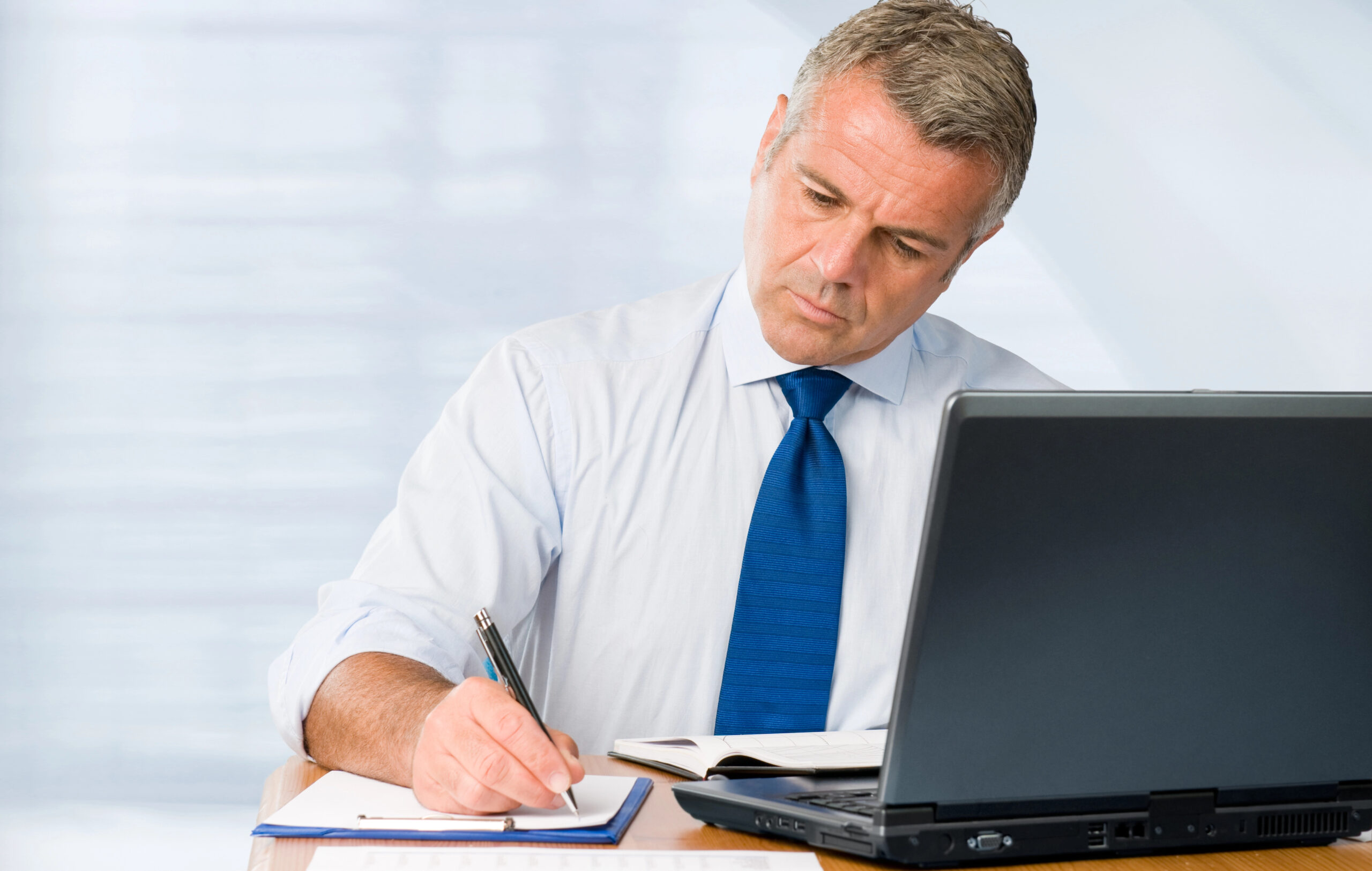 Professional man drafting a report